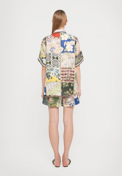 Patchwork shirt and shorts set made of lightweight fabric. Various patterns in pastel and vibrant colors. Short sleeves and relaxed fit.
