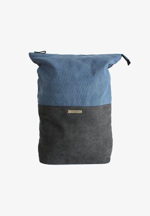Canvas backpack featuring a two-tone design with a light blue top and dark gray bottom, a cinched opening, and a small metal logo plate.