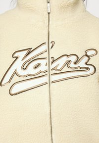 Karl Kani VARSITY TEDDY JACKET CREAM - Bomberjacka - cream