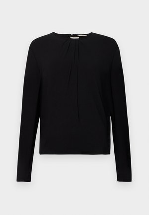 Top negro de manga larga con textura acanalada, cuello redondo y detalles plisados en la parte frontal, que ofrece un ajuste relajado.