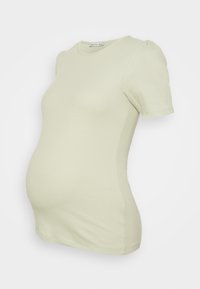 T-shirt de maternidade verde-claro com mangas bufantes curtas, textura canelada e cintura ajustada, projetada para conforto durante a gravidez.