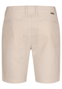 Beige Textur-Shorts mit mittelhohem Bund, aufgesetzten Taschen und glatter Oberfläche. Verfügt über gestickte Details und ein dezentes Markenetikett.