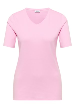 Haut rose clair à manches courtes pour femmes avec col en V et coupe ajustée, doté d'une petite étiquette en tissu à l'intérieur du col.