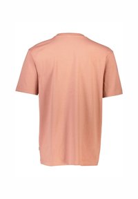 Kortärmad t-shirt i ljusrosa. Tillverkad av bomull med rund halsringning och rak fåll. Slät textur, enkel design utan utsmyckningar.