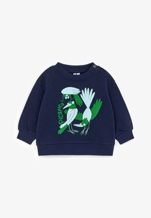 Sweatshirt bleu marine pour tout-petit avec des illustrations d'oiseaux abstraites en vert et blanc et le mot "picapica" sur le devant.