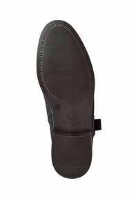 Černá gumová podrážka boty s texturovaným, vroubkovaným vzorem a zaobleným tvarem. Obsahuje označení velikosti a logo značky.