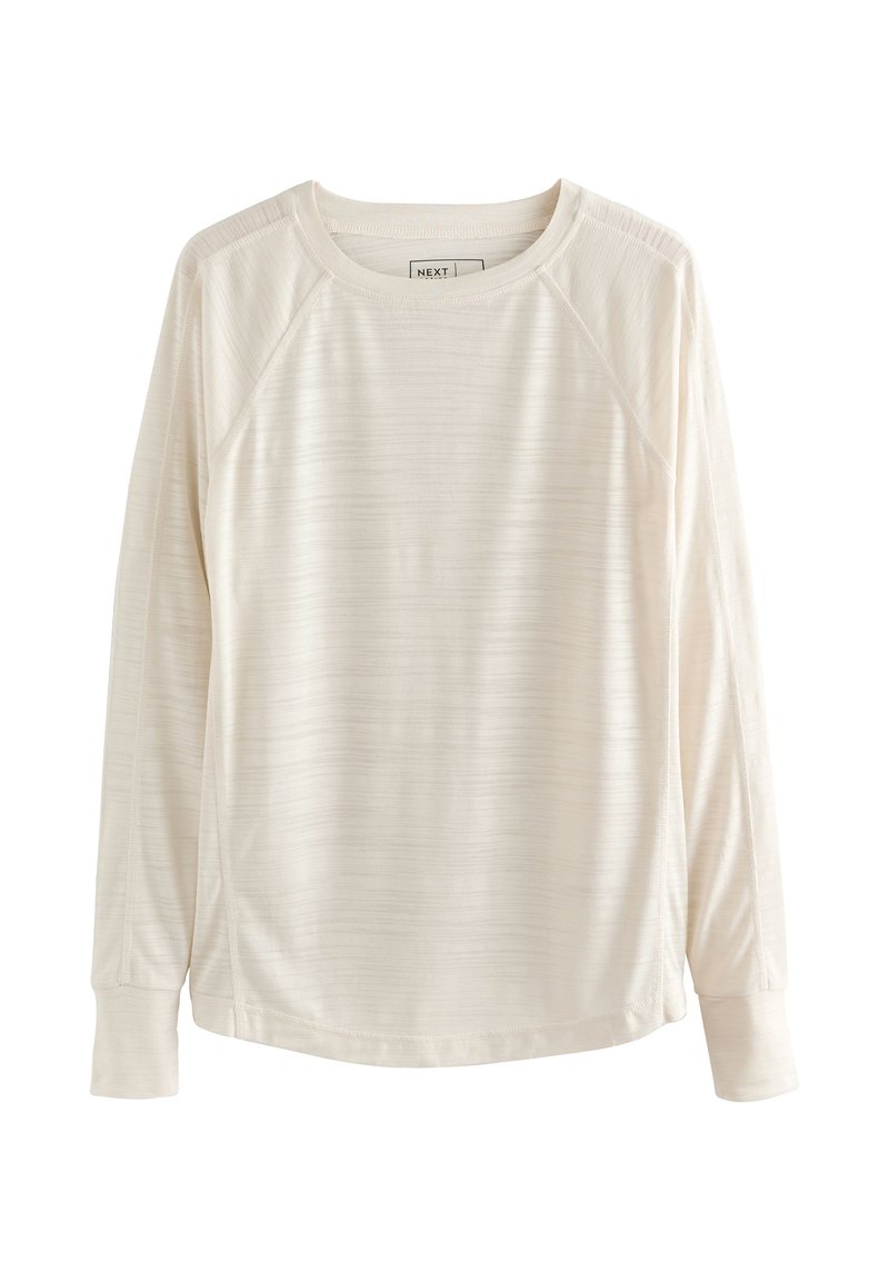 Long-sleeve shirt in light cream fabric with a textured stripe pattern, crew neckline, and raglan sleeves. Soft, lightweight material.