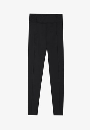 Black leggings featuring a smooth texture, high waistband, and stitching details along the sides. Slim-fit design, suitable for various activities.