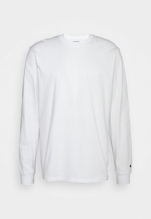 Camiseta blanca de manga larga hecha de algodón. Diseño de cuello redondo con puños acanalados y un pequeño logo en la manga izquierda. Textura suave.