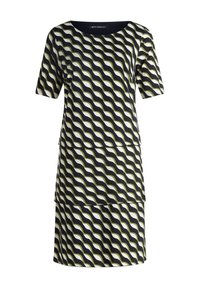 Sukienka z krótkim rękawem w wzór fal, w kolorach czerni, bieli i oliwy. Wykonana z gładkiego materiału, o luźnym kroju i warstwowej konstrukcji.