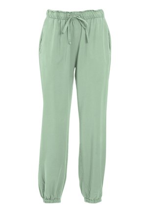 Pantaloni leggeri di colore verde chiaro, con vita elastica, cordoncino regolabile, tasche laterali e polsini elastici alla caviglia.