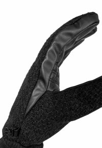 Schwarze Handschuhe mit einer strukturierten, wollähnlichen Außenseite und einer glatten Lederhandfläche, verstärkt durch Nähte und mit einem enganliegenden Bündchen.