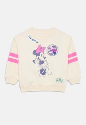 Sudadera crema con rayas rosas en las mangas. Presenta un gráfico de Minnie Mouse y el texto "BON-JUITFUL" arriba. Hecha de material suave.