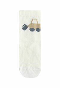 Chaussette crème clair avec un design de pelleteuse en cartoon beige et des roues noires. Texture lisse, longueur standard.