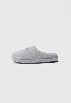 Grau-wollene Hausschuhe mit einer runden Zehenpartie, weichem Textil und einer gepolsterten Sohle. Verfügt über einen blauen Akzent entlang der Sohle und eine minimale Markenkennzeichnung oben.