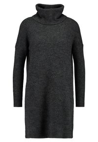 Maglione a collo alto lavorato a maglia di colore grigio scuro. Presenta maniche lunghe e una texture a coste. Lunghezza sotto i fianchi con una vestibilità comoda.