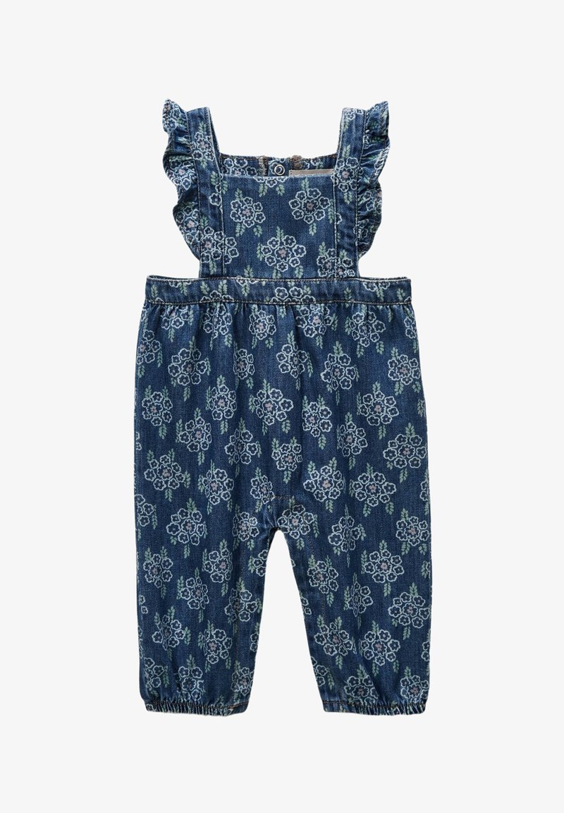 Salopette en denim avec des bretelles froncées, des poignets élastiques et un motif floral dans des nuances de bleu et de vert sur un fond bleu foncé.