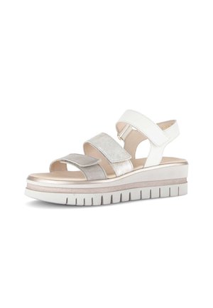 Witte en beige platform sandaal met drie verstelbare klittenbandsluitingen en een gegroefde zool voor extra grip.