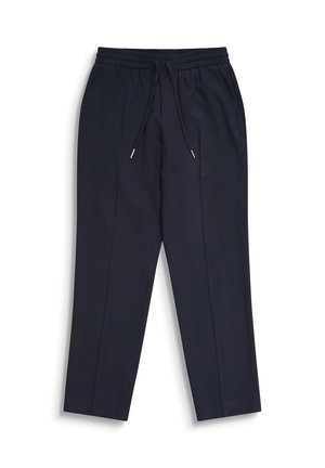 Pantalon bleu marine à coupe effilée avec taille élastique et cordon noir, poches latérales et plis sur le devant.
