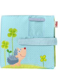 Soft fabric book with a light blue background, features a smiling hedgehog and green clover patterns, secured with a velcro strap.