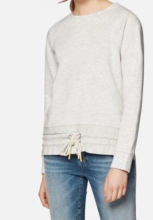 Sweat-shirt gris clair en tissu texturé, col rond et ourlet avec cordon de serrage élastique. Manches lisses et coupe décontractée.
