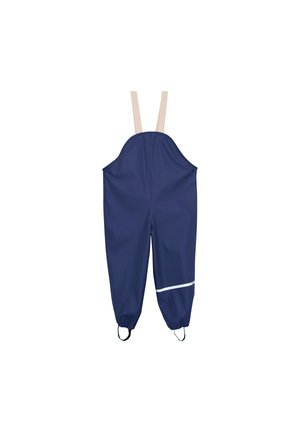 Salopette imperméable bleu marine avec bretelles beiges réglables, poignets élastiques et bande réfléchissante sur la jambe droite près de la cheville.