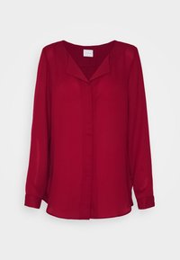 Blusa rossa a maniche lunghe realizzata in tessuto leggero. Caratterizzata da scollatura a V e patta centrale con bottoni, presenta una vestibilità comoda.