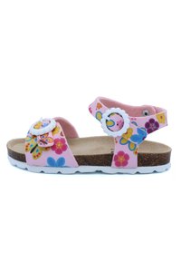 Sandales roses avec motifs floraux, brides réglables avec des accessoires circulaires blancs, semelle intérieure en liège et semelles en caoutchouc blanches.