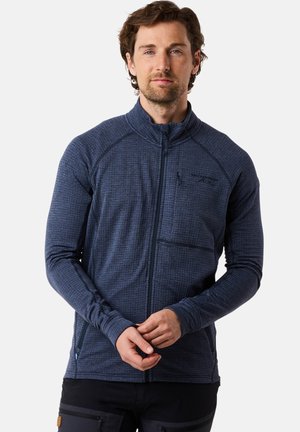 Fleecejacke in dunkelblau mit strukturiertem Muster, durchgehendem Reißverschluss, hohem Kragen und einer Brusttasche. Mit langen Ärmeln und tailliertem Design.