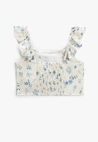 Blomster crop top i cremefarve med blå blomster. Har flæsekanter på stropperne og smock-detaljer i midten. Blødt bomuldsstof.