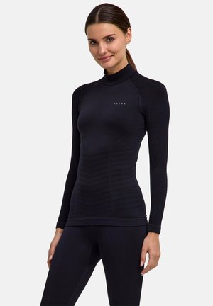 Schwarzes athletisches Oberteil mit langen Ärmeln, hohem Kragen, figurbetontem Design, strukturierten Akzenten und Markenlogo auf der Brust.