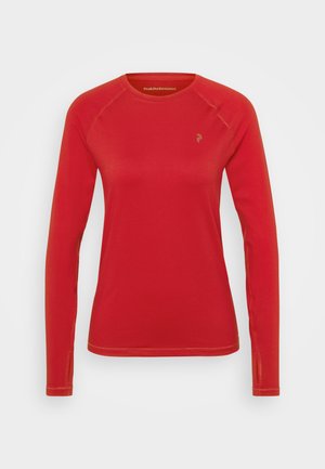 Camisa vermelha de manga longa feita de material sintético, com decote redondo, mangas raglan e um pequeno logótipo na parte do peito.