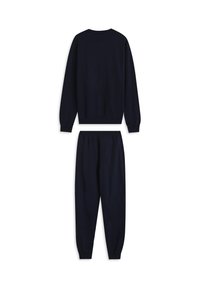 Chándal de algodón azul marino que incluye un top de manga larga y pantalones ajustados con cintura y puños elásticos, destacando una textura suave.