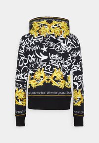 Svart hoodie med grafiska tryck i gult och vitt, med ett lejonmotiv, stiliserad text och ribbade ärmslut och fåll.