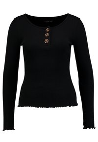 Zwart geribbelde lange mouw top met een ronde halslijn en drie bruine knopen op de borst. De zoom is iets rafelig.