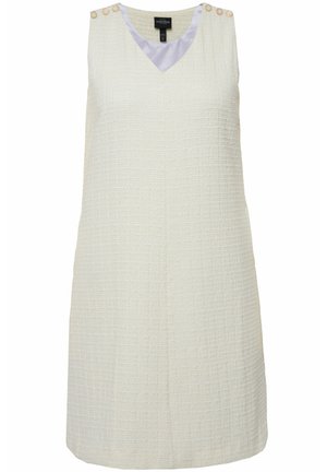 Mouwloze witte jurk met een textuurafwerking, V-hals en decoratieve knopen op de schouders. Heeft een ontspannen pasvorm en een vrouwelijk silhouet.