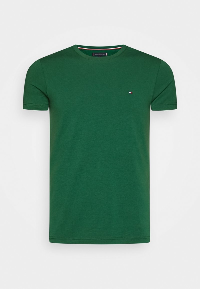 Zielony T-shirt z krótkim rękawem i okrągłym dekoltem, z małym logo Tommy Hilfiger na lewej piersi.