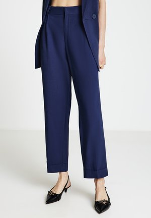 LUNGO UNITA - Pantaloni - blu