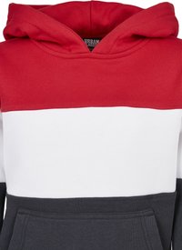 Felpa con cappuccio caratterizzata da blocchi di colore rosso, bianco e blu navy. Presenta una tasca frontale e un tessuto testurizzato per comfort e calore.