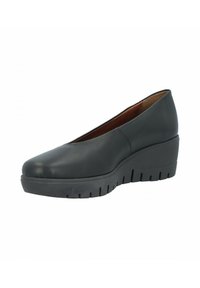 Tacones de cuña de cuero negro con punta redondeada, suela texturizada y parte superior lisa. Diseño minimalista sin adornos.