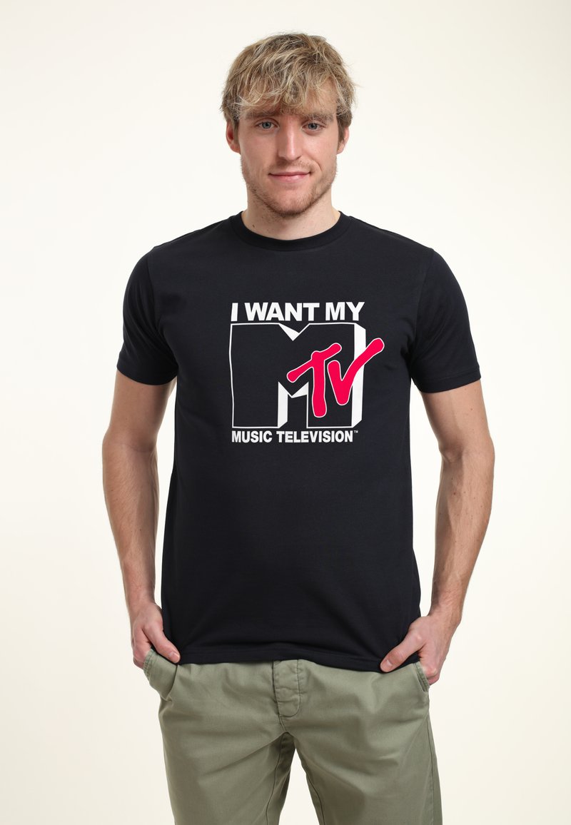 Black cotton t-shirt featuring a white and pink graphic design with the text "I WANT MY MTV MUSIC TELEVISION." Short sleeves and crew neck.