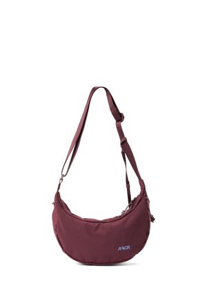 Maroon crescent-shaped shoulder bag with adjustable strap and small blue logo on front.