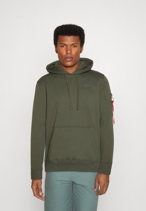 Olive green hooded sweatshirt, cotton blend, front pocket, ribbed cuffs and hem, features side zipper pocket with red accent.