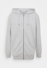 Haut de survêtement zippé gris clair en mélange de coton. Doté d'une capuche à cordon de serrage, de deux poches latérales et de poignets et d'un bas côtelés. Texture lisse.