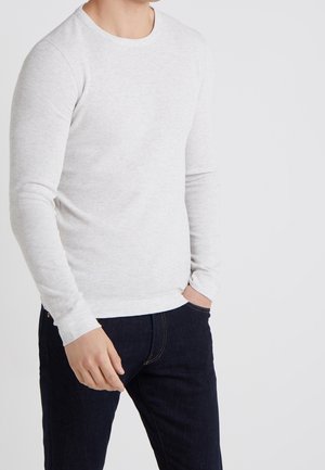 Stickad tröja - beige