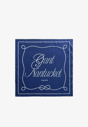 Foulard carré bleu avec bordure en corde blanche et texte en cursive "Gant Nantucket 1949" centré à l'intérieur.