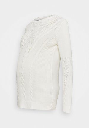 Maglione premaman bianco a trecce con maniche lunghe, dotato di scollatura rotonda e motivi testurizzati sul corpo e sulle maniche.
