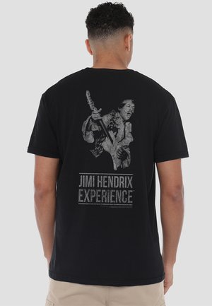 Black cotton t-shirt featuring a large, distressed gray graphic of a musician playing guitar and "Jimi Hendrix Experience" text below.