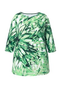 Zielony top z nadrukiem, z okrągłym dekoltem i rękawami długości do połowy przedramienia. Charakteryzuje się botanicznym wzorem w różnych odcieniach zieleni z czarnymi akcentami.