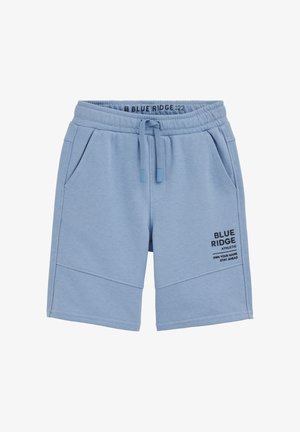 Helesinised spordipüksid elastse vöökohaga, paelaga, küljetaskutega ja paremal jalal trükitud tekstiga "BLUE RIDGE ATHLETIC".